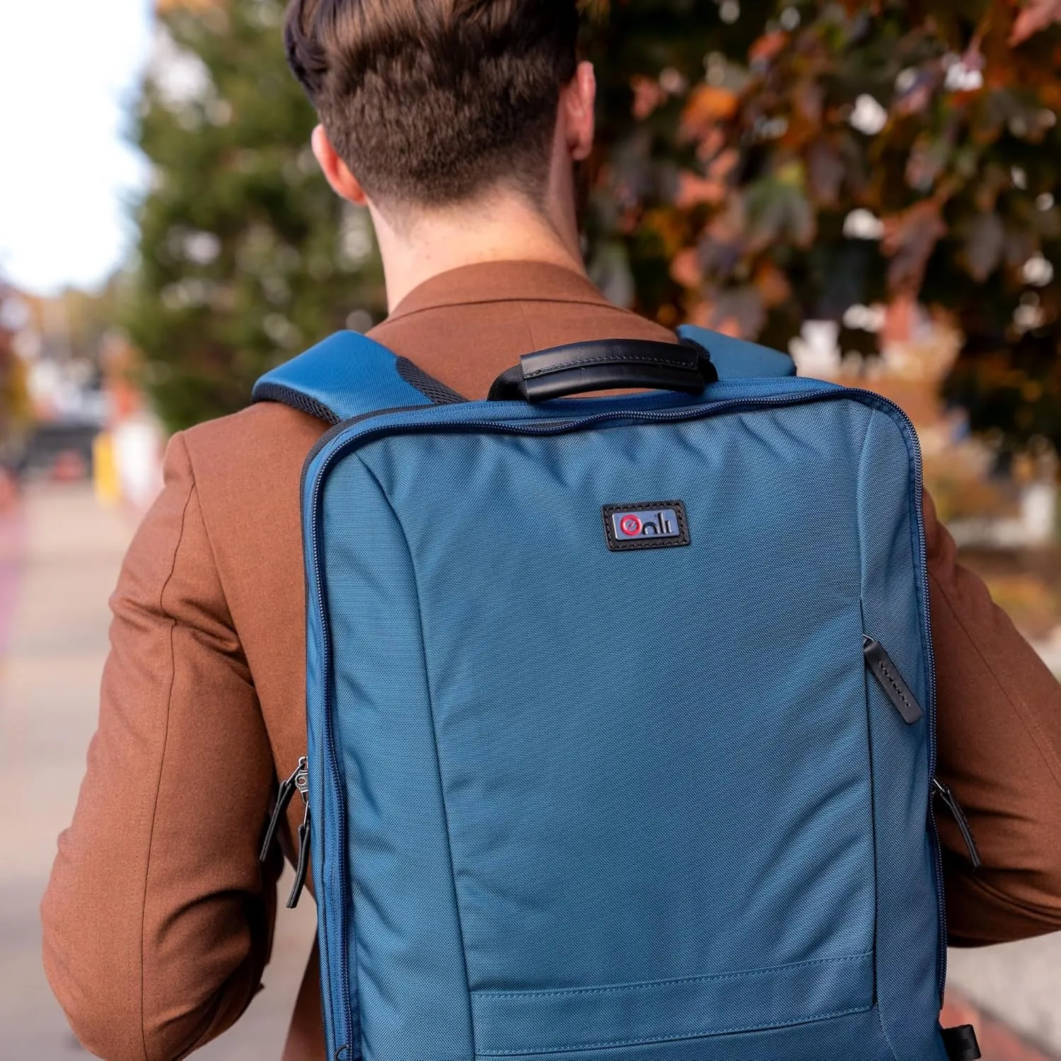 Trilogy Weekender Daypack I Opens like a suitcase, for easy packing. Expands into a 22-liter weekender. Hidden under-bag sling holds yoga mat/sleeping bag, and doubles as a rear cover (Blue)